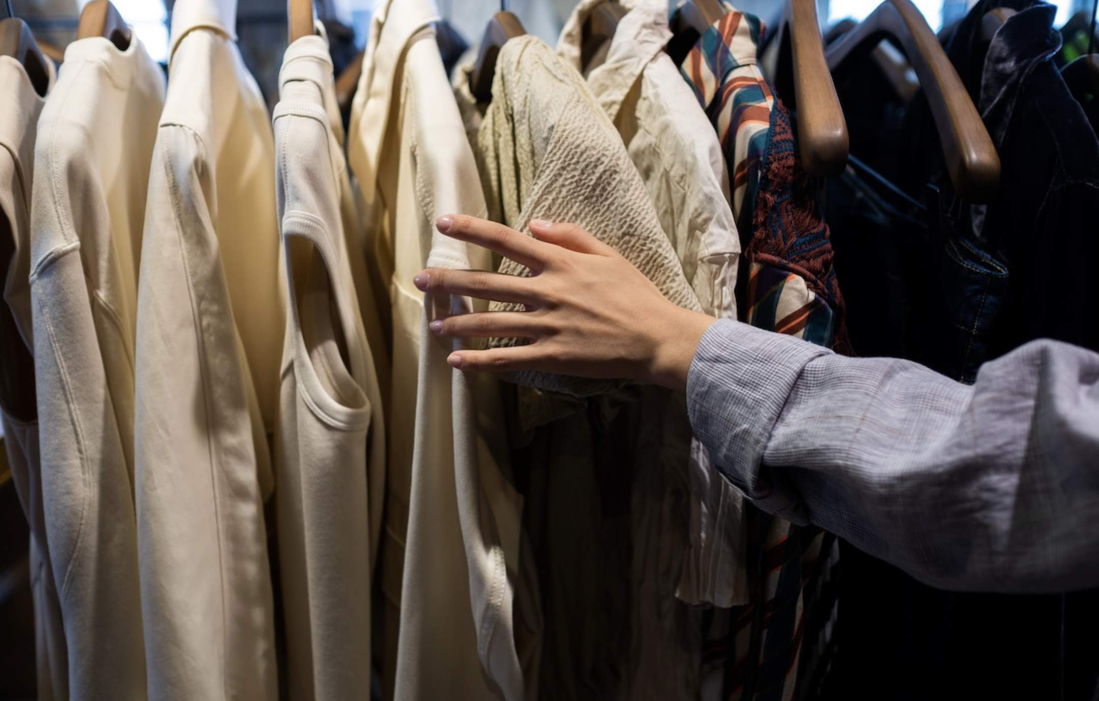 Hanging clothes to embrace sustainability through second-hand fashion