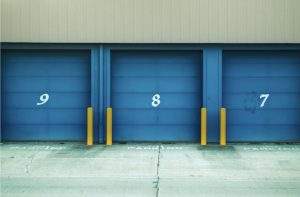 Three blue, numbered doors to storage spaces.
